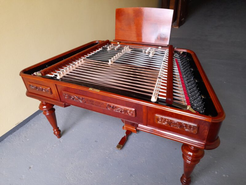 Carved cimbalom in cherry colour, with handmade politur
