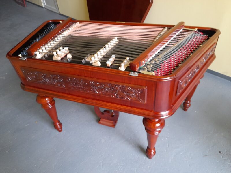 Carved cimbalom in cherry colour, with handmade politur