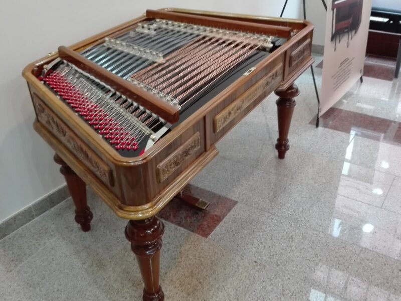 Carved cimbalom in walnut colour, with handmade politur